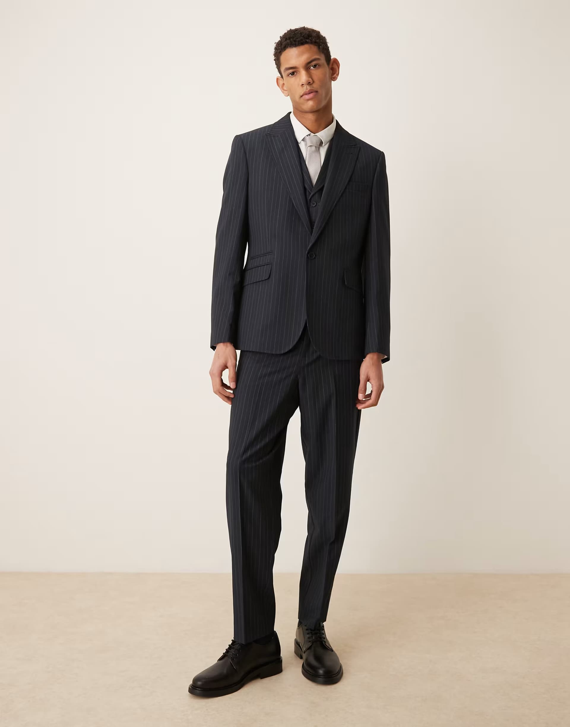 ASOS ASOS DESIGN relaxed tapered suit trousers in navy pinstripe