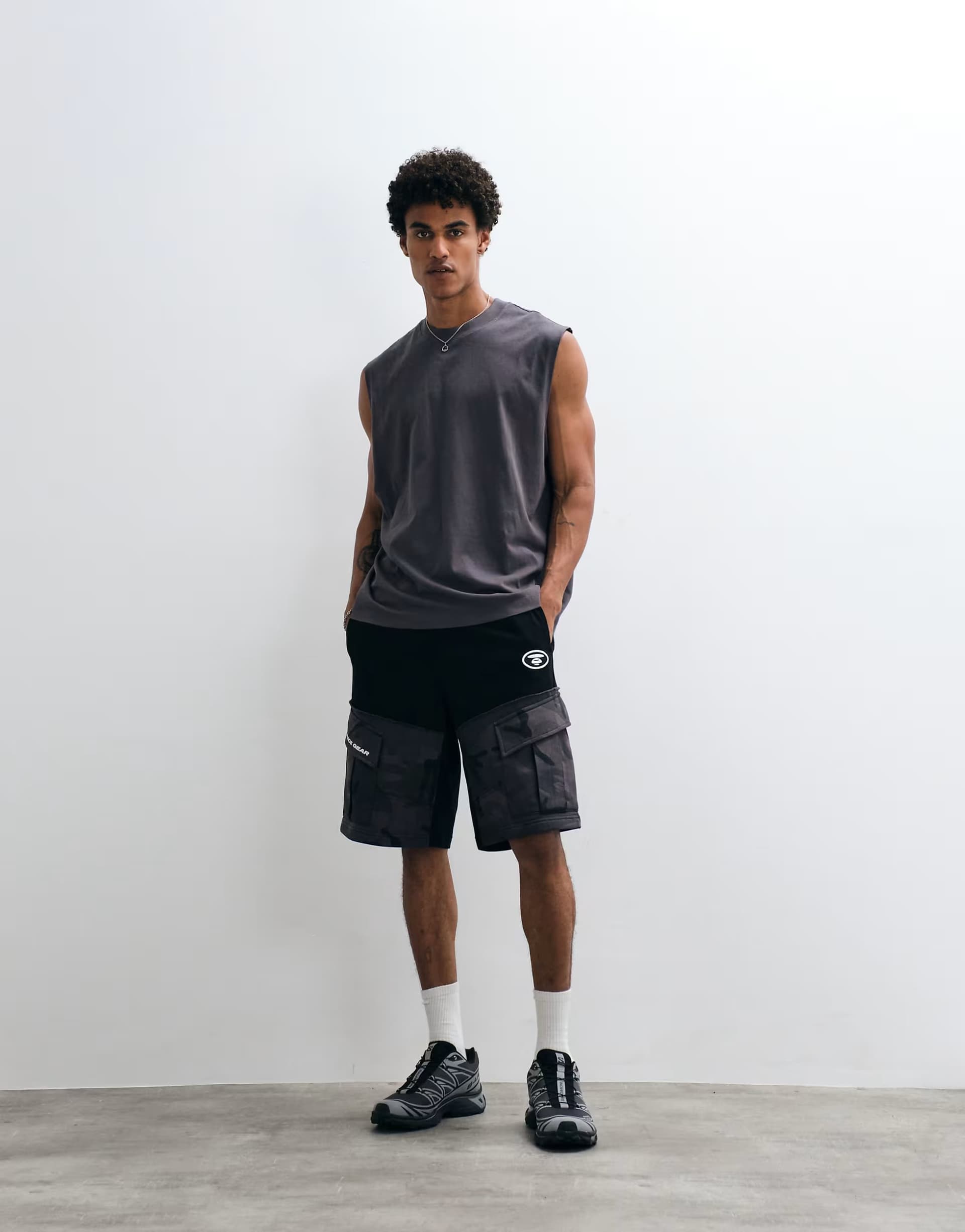 ASOS Aape by A Bathing Ape loose fit jersey motocross shorts in black with camo pockets