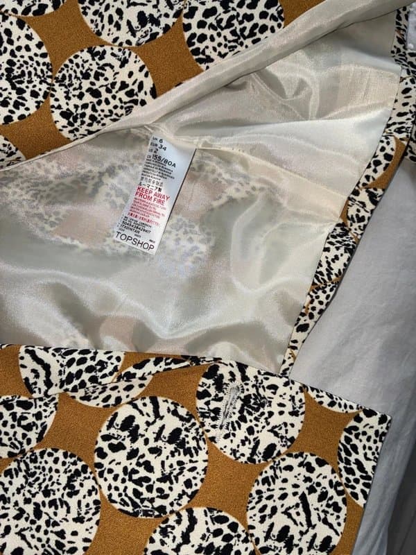 Topshop Ladies Top shop short lined jacket in abstract animal print with long sleeves fluted on end