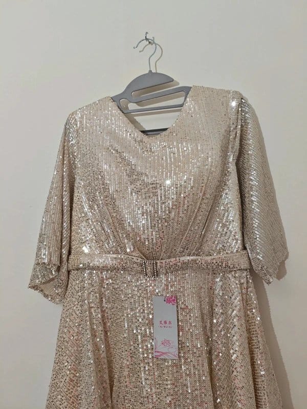 Exquisite Sequin-Embellished Long Gown with Dramatic Flared Skirt