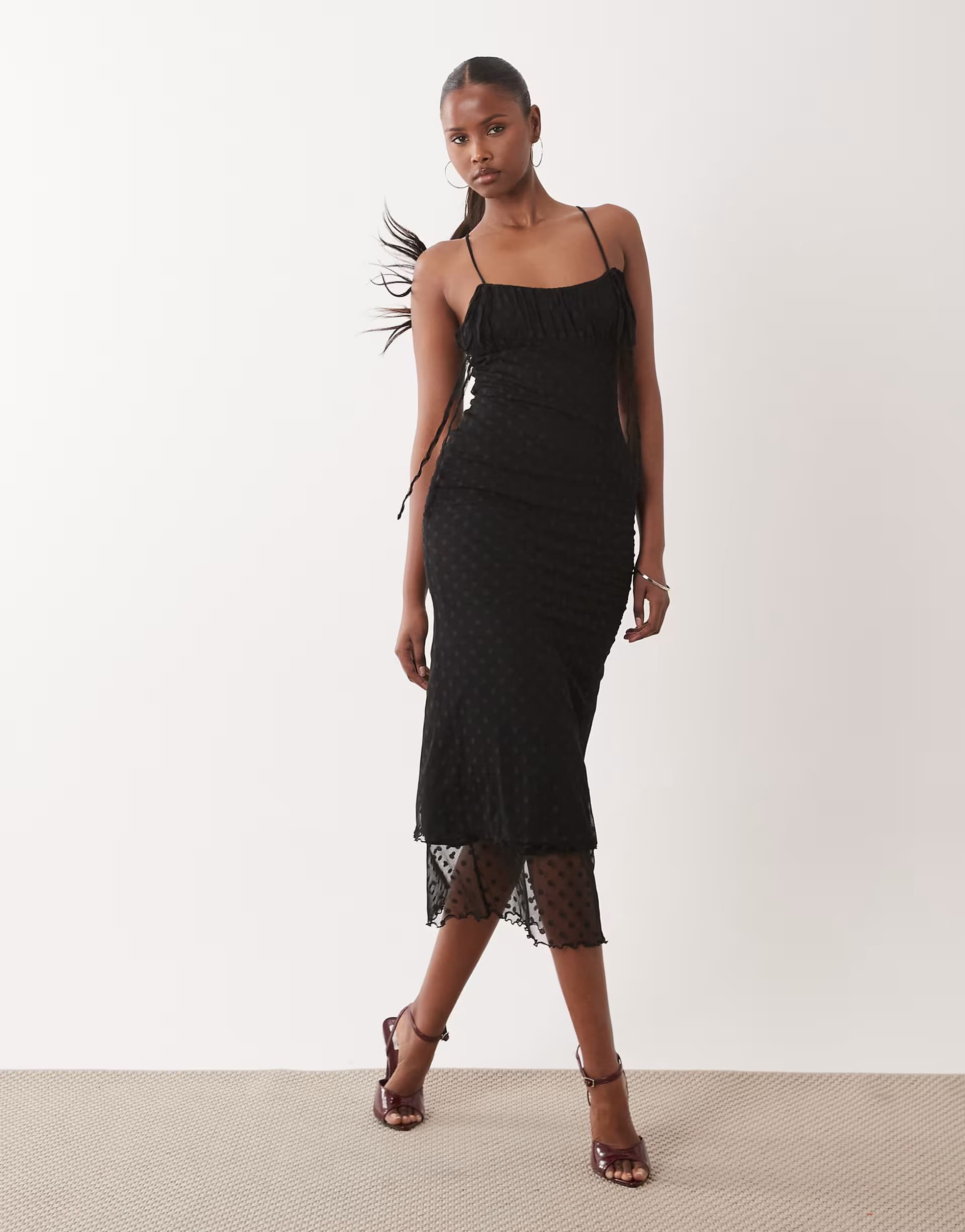 ASOS ASOS DESIGN awkward length dobby mesh slip dress with ruched bust and peek a boo hem detail in black