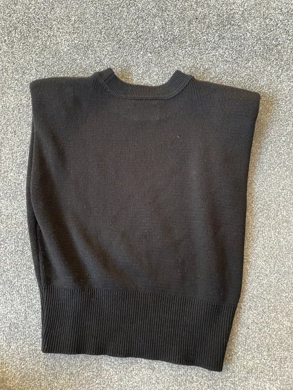 ASOS Design Ladies sleeveless knitted black top with metal framed holes for decoration sizeXS new without tags