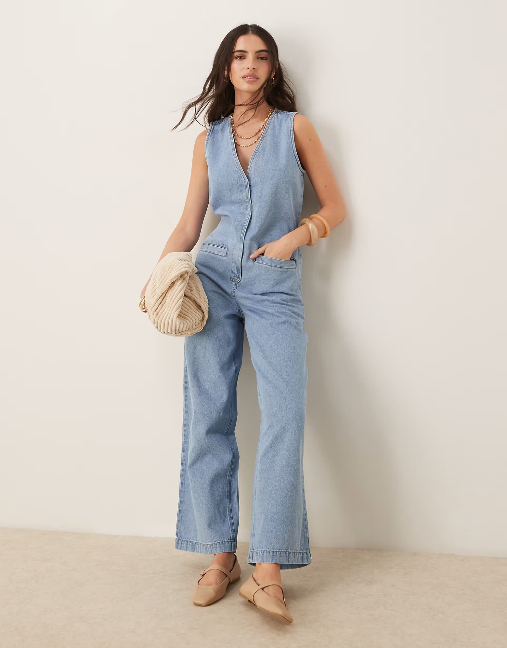 ASOS ASOS DESIGN denim sleeveless jumpsuit with tie back in lightwash blue