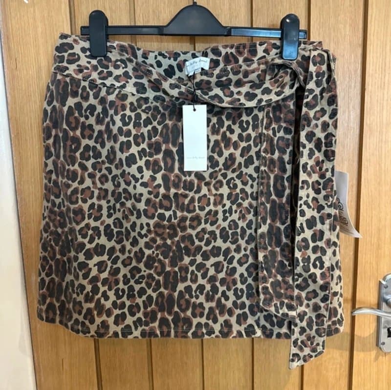 Never Fully Dressed Never fully dressed leopard wrap skirt