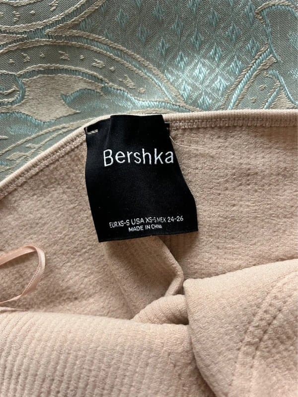 Bershka Bershka beige ribbed strapless bandeau style crop top with diamanté embellished cut out details