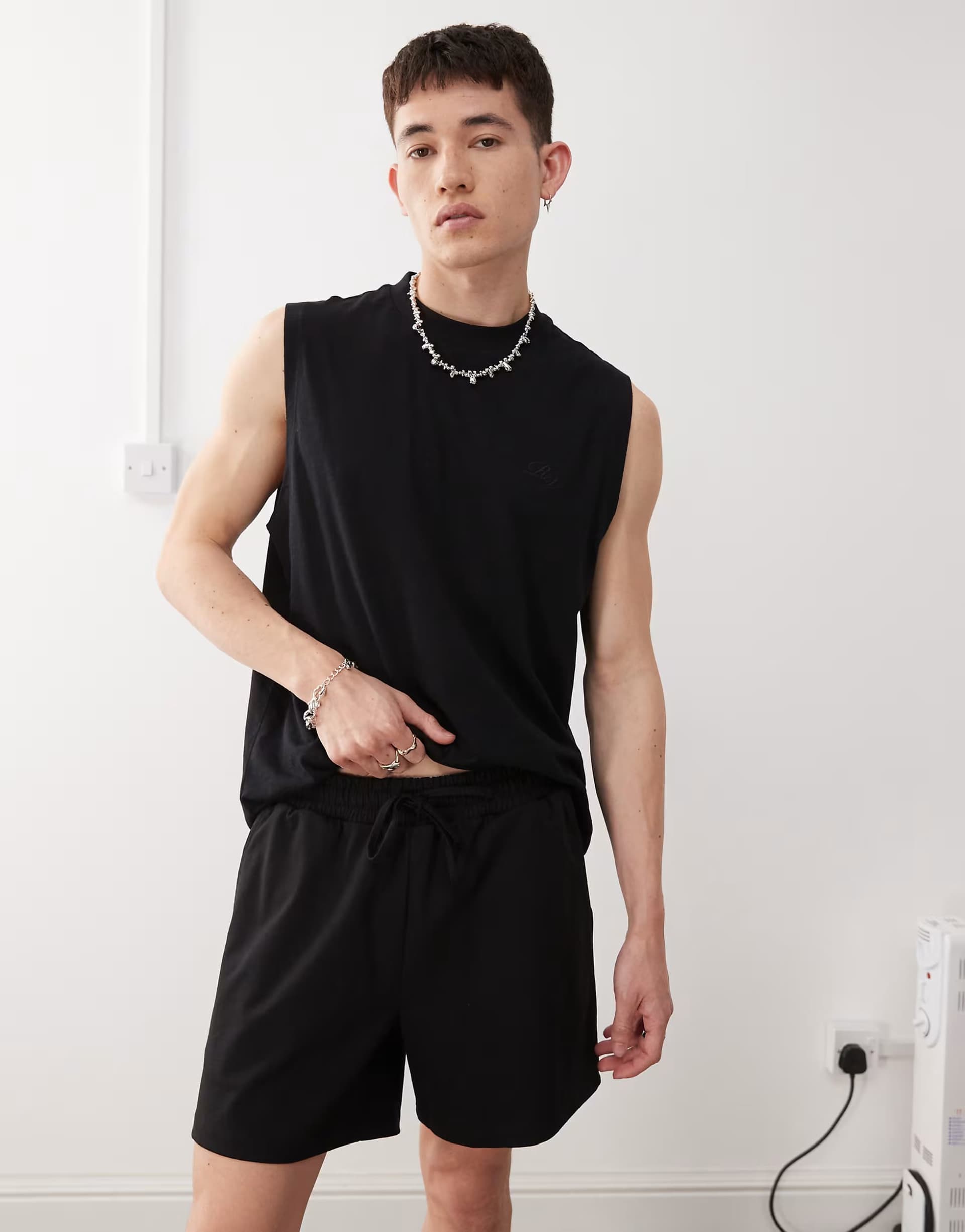 ASOS Reclaimed Vintage shorter length jersey shorts in black