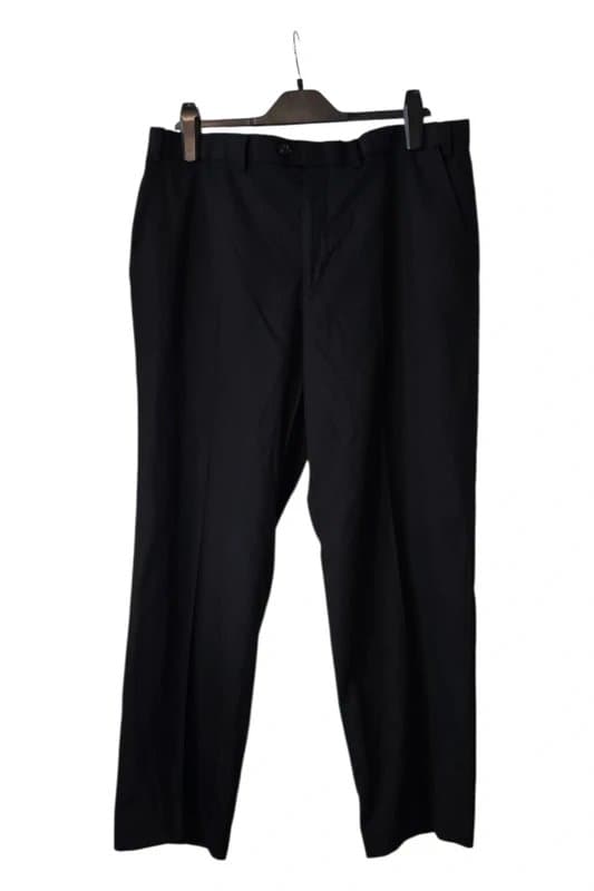 Marks & Spencer Classic black trousers with a regular fit.