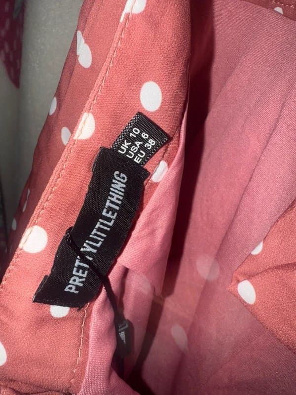 PrettyLittleThing Pretty Little Thing Polks Dot Tie Back Playsuit.