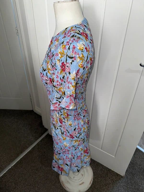 Never Fully Dressed Never Fully Dressed mini dress size medium Blue Floral Shirred Mini Dress Size M