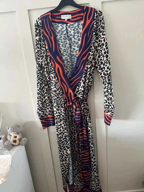 Never Fully Dressed Never fully dressed woman's wrap dress.